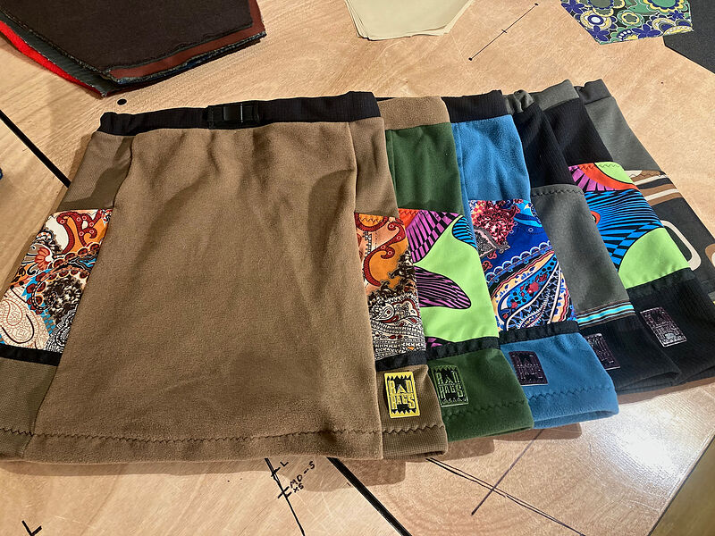 A row of fleece skirts with bright patterned panels and Rad Rags labels