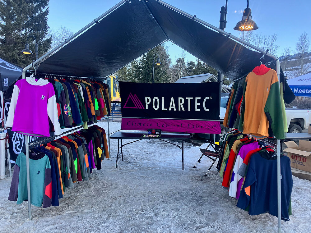 Rad Rags pop-up tent in the snow with racks of fleece and a Polartec banner
