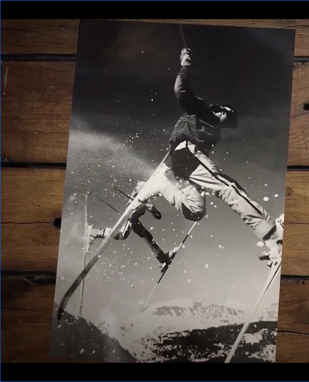 Vintage black and white photo of a skier in mid-air, from the wall of fame at Monarch Mountain Lodge