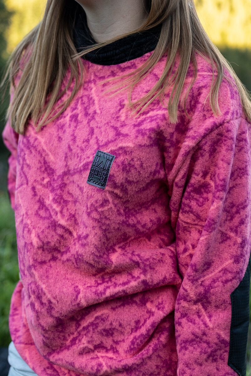 Model in a pink and purple print fleece